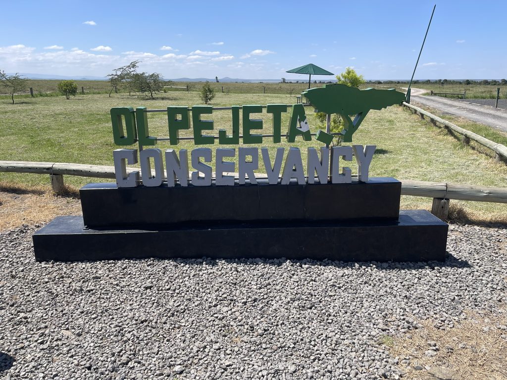 Ol Pejeta Conservancy sign with rhino logo in Kenya